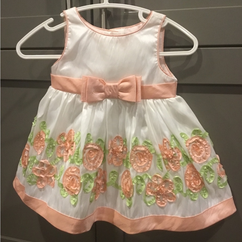 Youngland 3/6 month dress with polyester lining and tulle underneath.